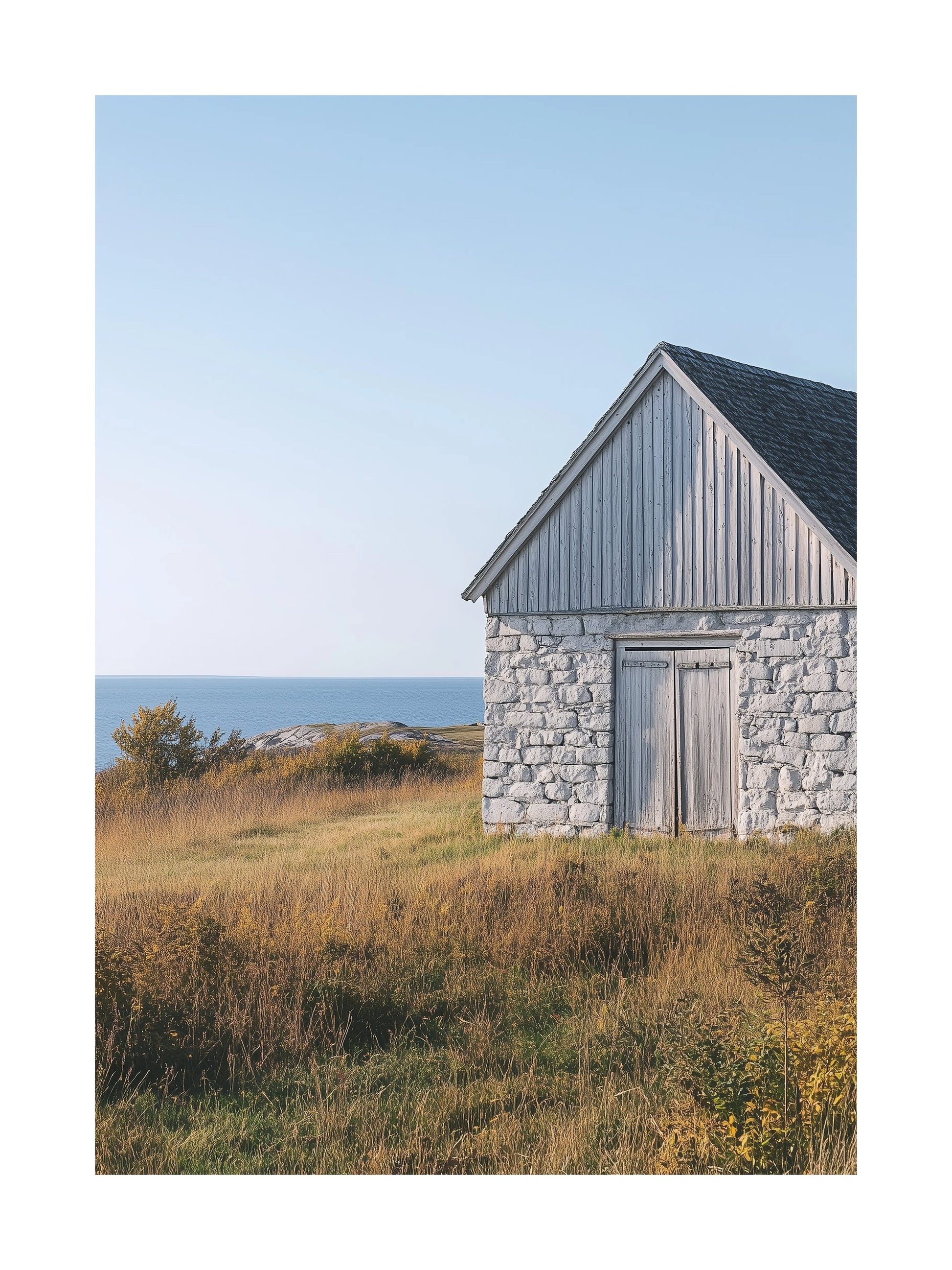 Poster of a weathered stone barn on Gotland with sea in the background