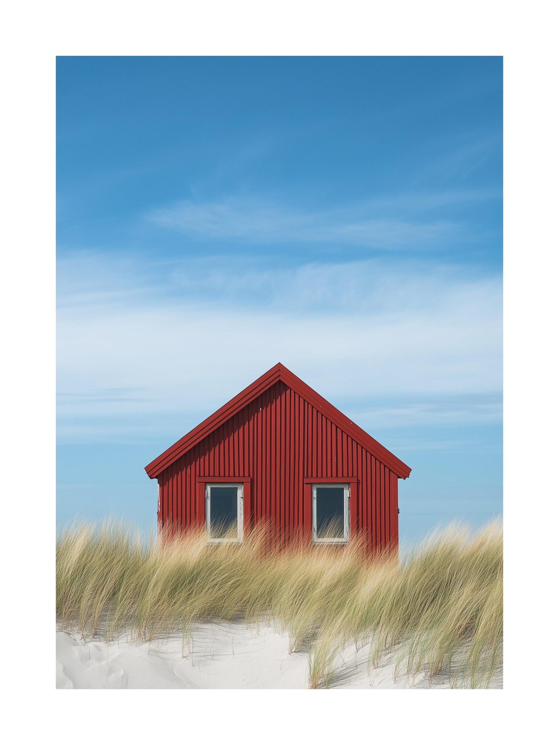 Red cabin in Falsterbo surrounded by beach grass and blue sky