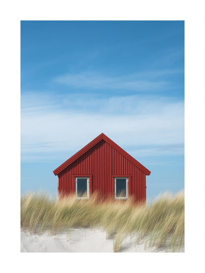 Red cabin in Falsterbo surrounded by beach grass and blue sky