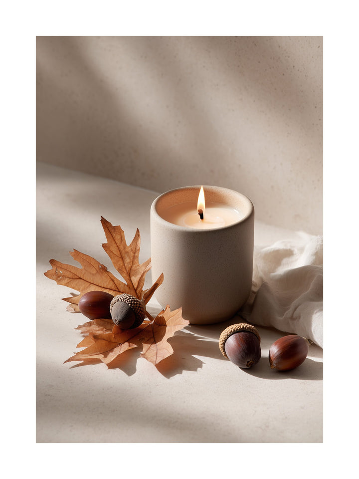 Minimalist poster of a lit candle with acorns and autumn leaves