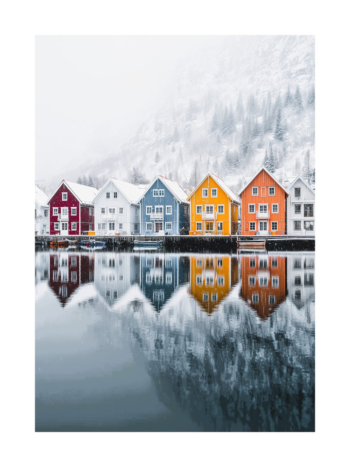 Colorful Nordic houses reflected in lake during winter with snow-covered landscape