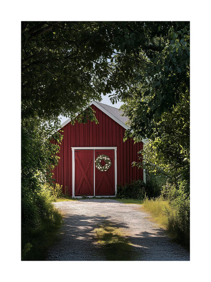 Red barn with a floral midsummer wreath on doors, framed by green trees