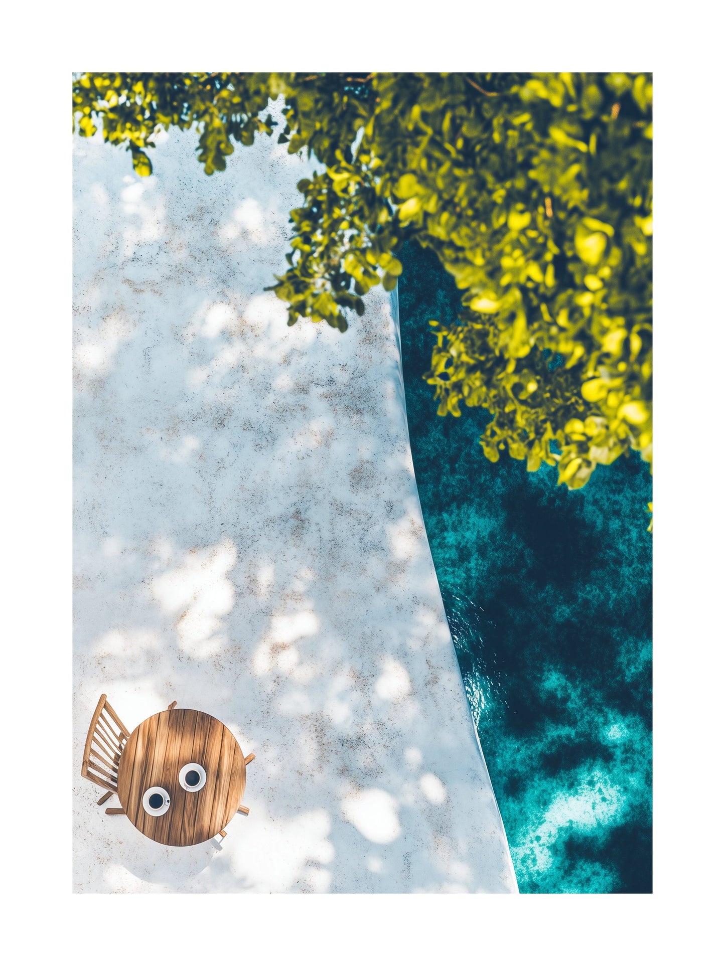 Overhead view of a café table with two cups on a white sunlit terrace. Ideal for wall art in your home, office, or studio.